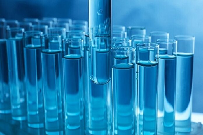 Taking,Test,Tube,With,Liquid,Sample,,Closeup